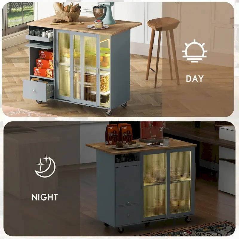 Îlot de cuisine avec surface à rabat, éclairage LED, portes en verre cannelé, étagère réglable, deux tiroirs et roulettes.